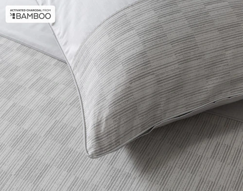 Close-up of the textured band edge and corner of our Marco Pillow Sham.