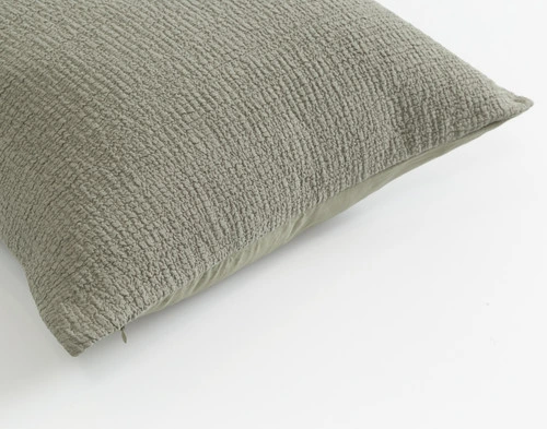 Angled view of the edge of our Crinkle Euro Sham in Sage with the front side up.