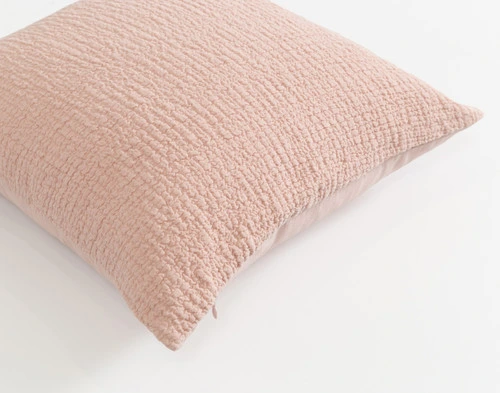 Top angled view of our Crinkle Square Cushion Cover in Peony showing its front side.