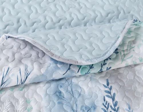 Close-up on the folded corner on our Eliana Coverlet Set.