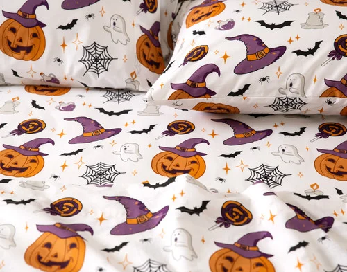 Closer view of the witch hats and jack-o'-lanterns on the surface of our Hallows Eve Cotton Percale Sheet Set.