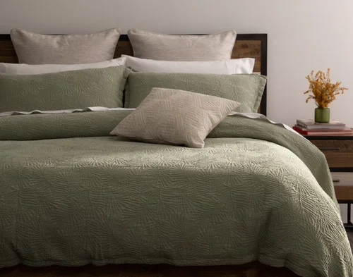Front, off-centre view of our Matosa Duvet Cover dressing a queen bed with matching accessories.