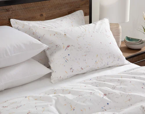 Angled view of our Memories collection dressing the head of a bed.