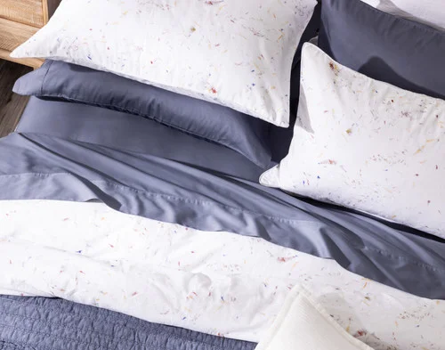 Our Memories Pillow Shams dressing the head of a bed with the Memories Duvet Cover.