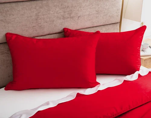 The pillow shams from our Heartfelt Duvet Cover Set dressing the head of a bed.