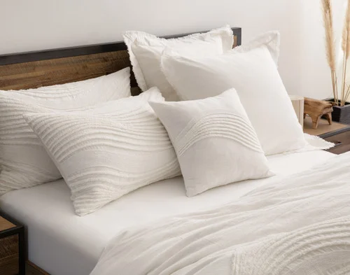 Our Savary collection dressing the head of a bed in a simple room.