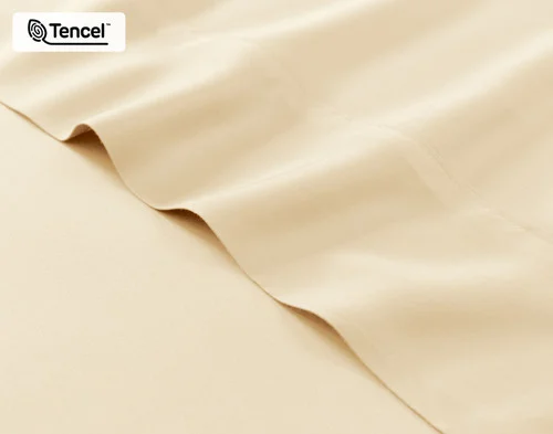 Close-up on the fitted and flat sheet of our BeechBliss TENCEL™ Modal Sheet Set in Cornsilk.