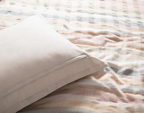 The reverse side of our Carmen Pillow Sham atop our Carmen Duvet Cover.