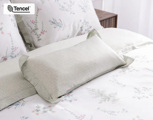 Our Annika Boudoir Pillow Cover with our Annika collection at the head of a bed.