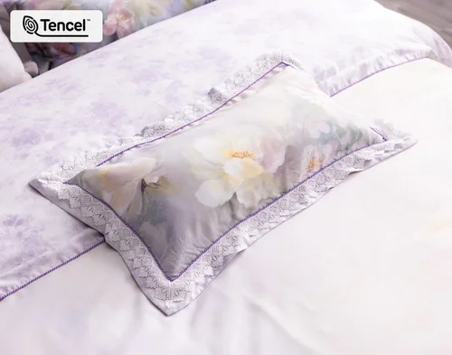 Angled view of our Constance Boudoir Pillow Cover resting on a coordinating bed.