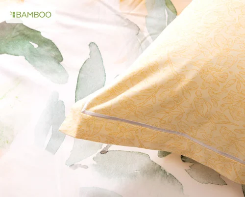 The corner of our Oriana Euro Sham atop our Oriana Duvet Cover.