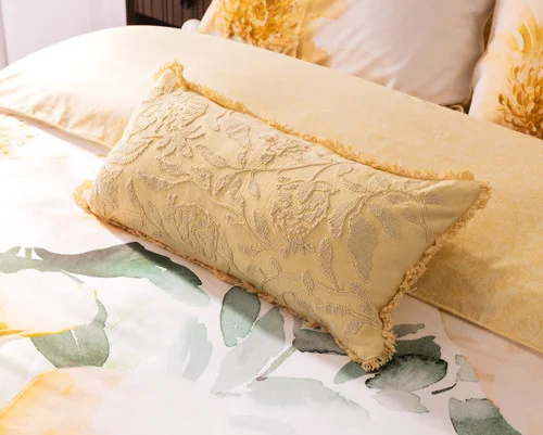 Our Oriana Boudoir Pillow Cover decorating a bed with our Oriana collection.