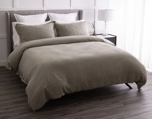 Angled view of our Arden Duvet Cover Set dressing a queen bed.