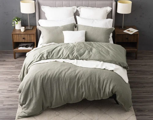 Top-down view of our Arden Duvet Cover Set dressing a queen bed with white accessories.