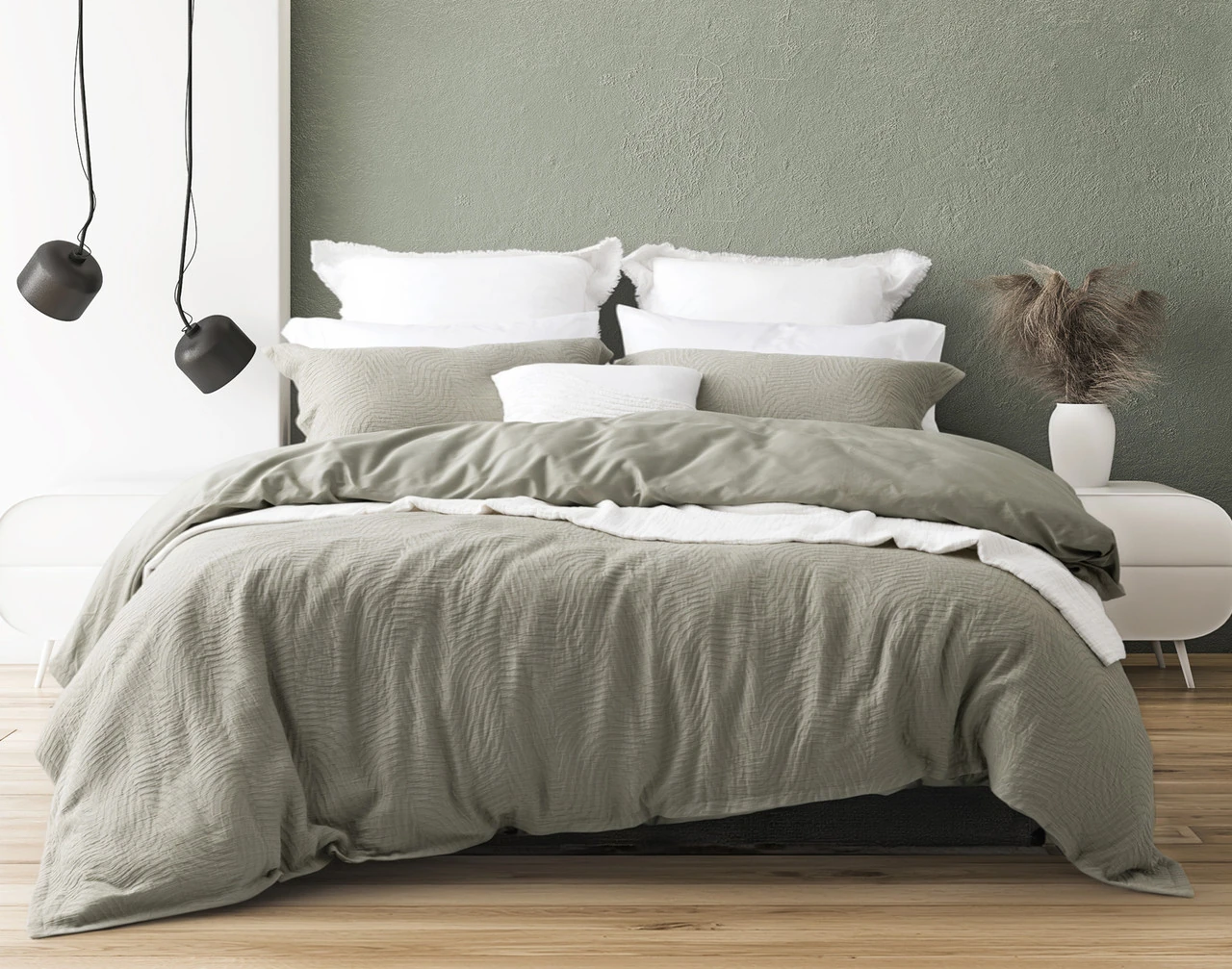 Front view of our Arden Duvet Cover Set dressing a queen bed with white accessories.