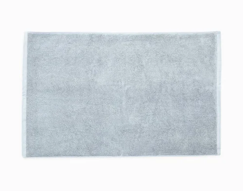 Our Blue Dusk Modal Cotton Face Towel sitting flat on a white backdrop.
