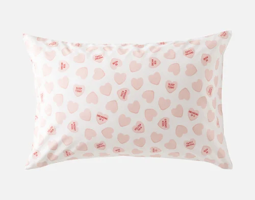 Our Pillow Talk Pillowcase  - Candy Hearts on a white background.