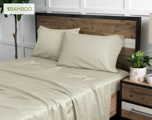 Angled view of our Bamboo Cotton Sheet Set in Thistle dressing a bed in a simple bedroom.