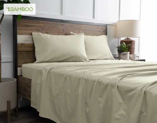 Angled view from below of our Bamboo Cotton Sheet Set in Thistle dressing a bed in a simple bedroom.