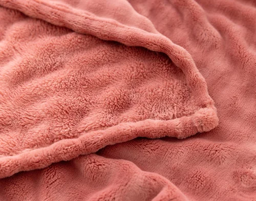 Folded edge of our Potpourri Bubble Breeze Throw to show its surface and reverse.