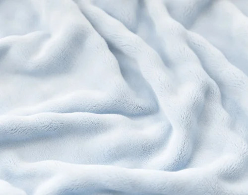 Close-up of the bubbled texture on our Powder Blue Bubble Breeze Throw.