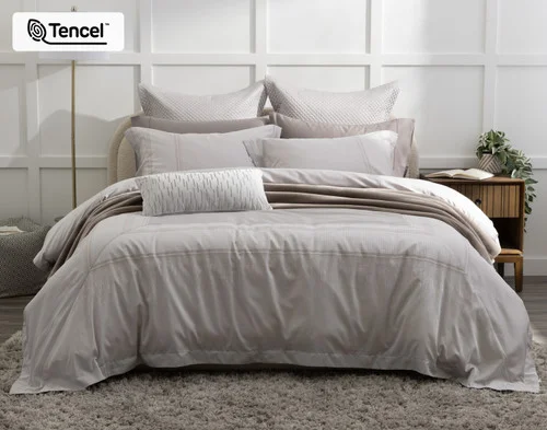 Front view of our Renley Duvet Cover dressing a queen bed with accessories.