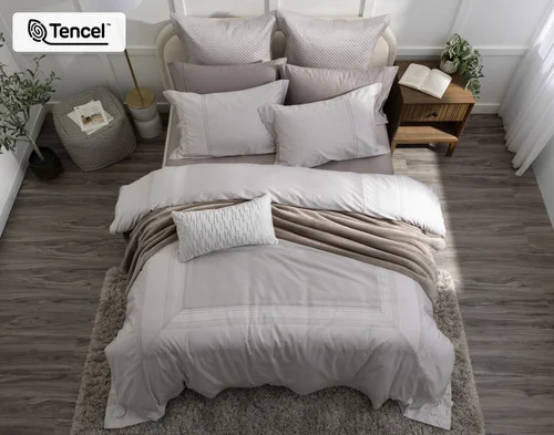 Top-down view of our Renley Duvet Cover dressing a queen bed with accessories.