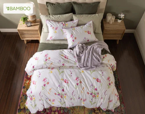 Top-down view of our Delicata collection dressing a queen bed with green accessories.