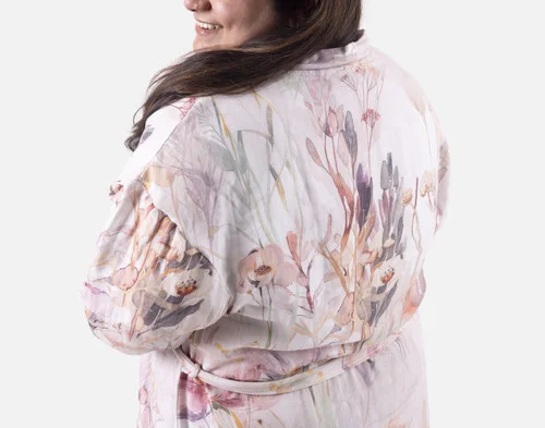 Shoulder view of a woman wearing our Bamboo Cotton Gauze Bathrobe in Peach Blossom.