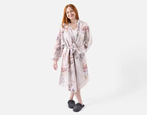 Front view of a woman wearing our Bamboo Cotton Gauze Bathrobe in Peach Blossom.