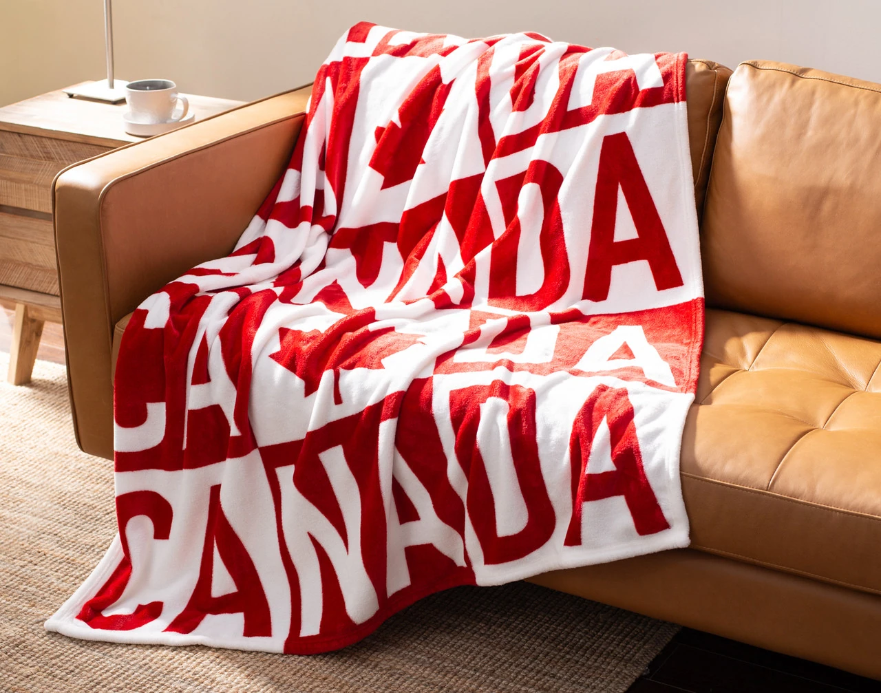 Angled view of our Canada Check Fleece Throw draped gently over a couch.