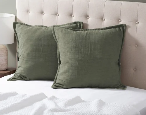 Our Bamboo Gauze Euro Shams in Leaf at the head of a bed.