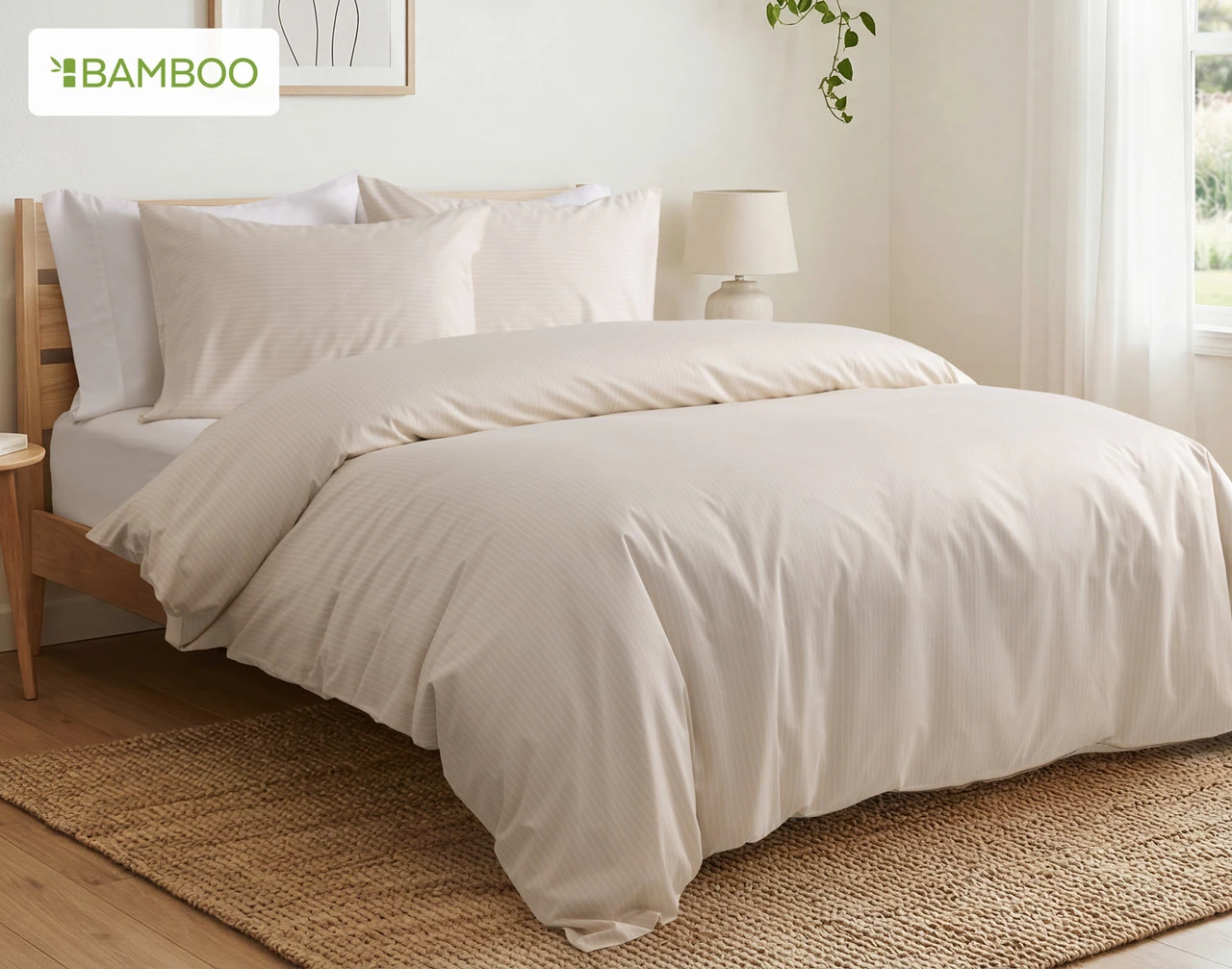 Angled view of our Sandy Stripe Bamboo Cotton Duvet Cover over a plain queen bed.