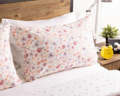 The head of a bed dressed in our Poppy Kids' Bamboo Cotton Comforter Set.