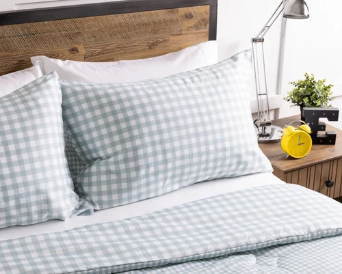 The head of a bed dressed in our Picnic Kids' Bamboo Cotton Comforter Set.