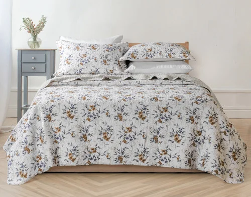 Our Esther Cotton Quilt Set dressing a queen bed in a modern bedroom.
