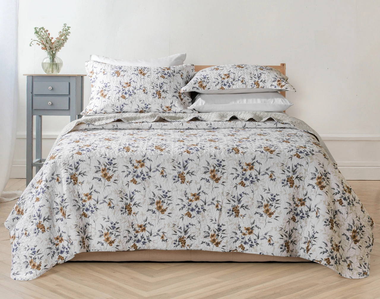 Our Esther Cotton Quilt Set dressing a queen bed in a modern bedroom.
