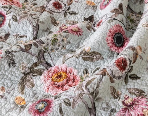 Close up on our Eloise Cotton Quilt Set to show its floral pattern.