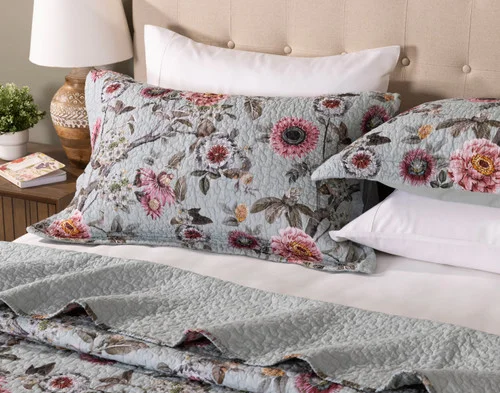 Our Eloise Cotton Quilt Set dressing the head of a bed.