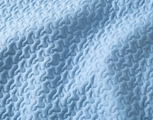 Close-up of the solid blue reverse on our Delphine Coverlet Set.
