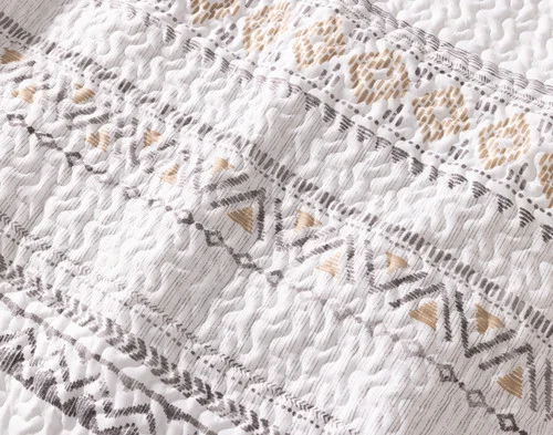 Close-up of the patterned surface on our Niko Coverlet Set.