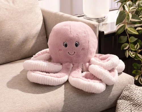 Our Octavia Octopus Cushion on a couch.