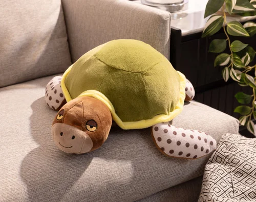 Our Dotty Turtle Cushion lying on a couch.