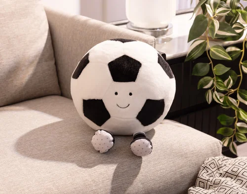 Our Footy Soccer Ball Cushion on a couch.