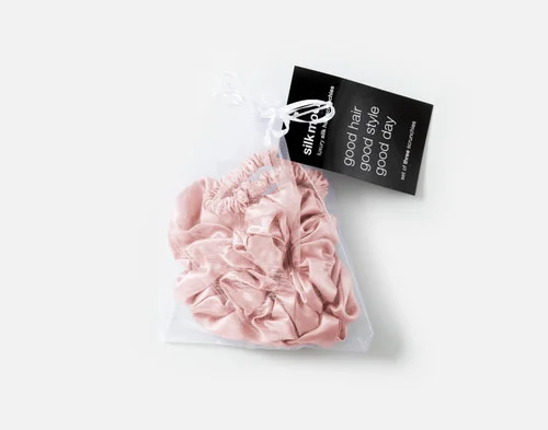 Top view of the mesh bag packaging holding our Blush Mulberry Silk Scrunchie Set.