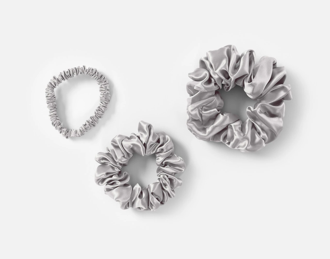 Top view of the small, medium and large scrunchies in our Silver Mulberry Silk Scrunchie Set.