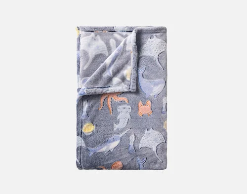Our Under the Sea Glow In The Dark Throw folded into a rectangle.