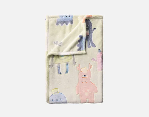 Our Snuggle Monsters Glow In The Dark Throw folded into a rectangle.