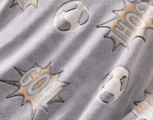 Close-up on the etched designs on our Kickoff Glow In The Dark Throw.