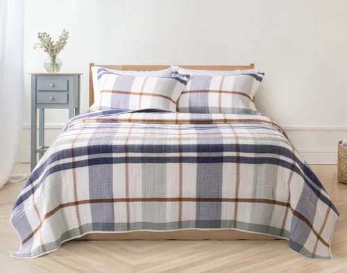 Front view of our Finn Quilt Set dressing a queen bed in a modern bedroom.